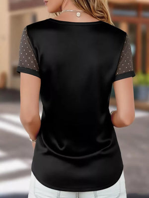 Black satin V-neck t-shirt with sheer polka dot sleeves.