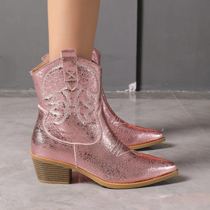 Pink boots featuring pointed toe and embroidered