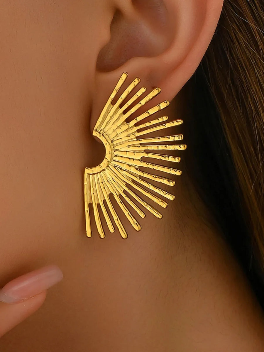 Gold earrings featuring gold-plated and geometric