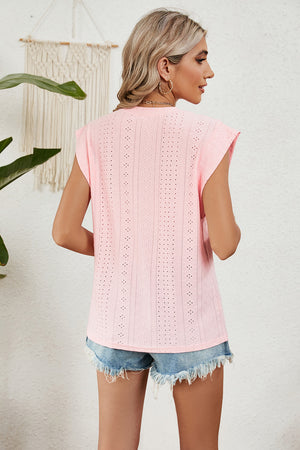 Blush pink perforated shoulder-pad top with cap sleeves and a casual cut.