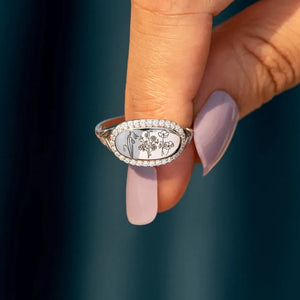 Silver signet ring with engraved floral design and pave crystal border