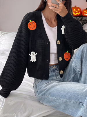 cardigan in black featuring buttoned and relaxed fit