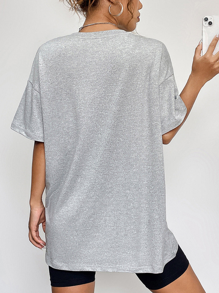 Grey graphic t-shirt with crew neck and short sleeves.