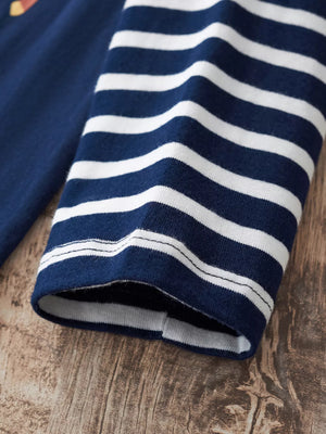 Dark navy and white striped long-sleeve baby tee with a graphic detail on the chest.
