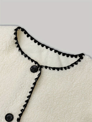 ivory jacket with contrast trim and long sleeve
