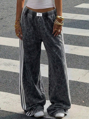 track pants featuring striped in White with 100% polyester Care instructions: Machine wash cold texture