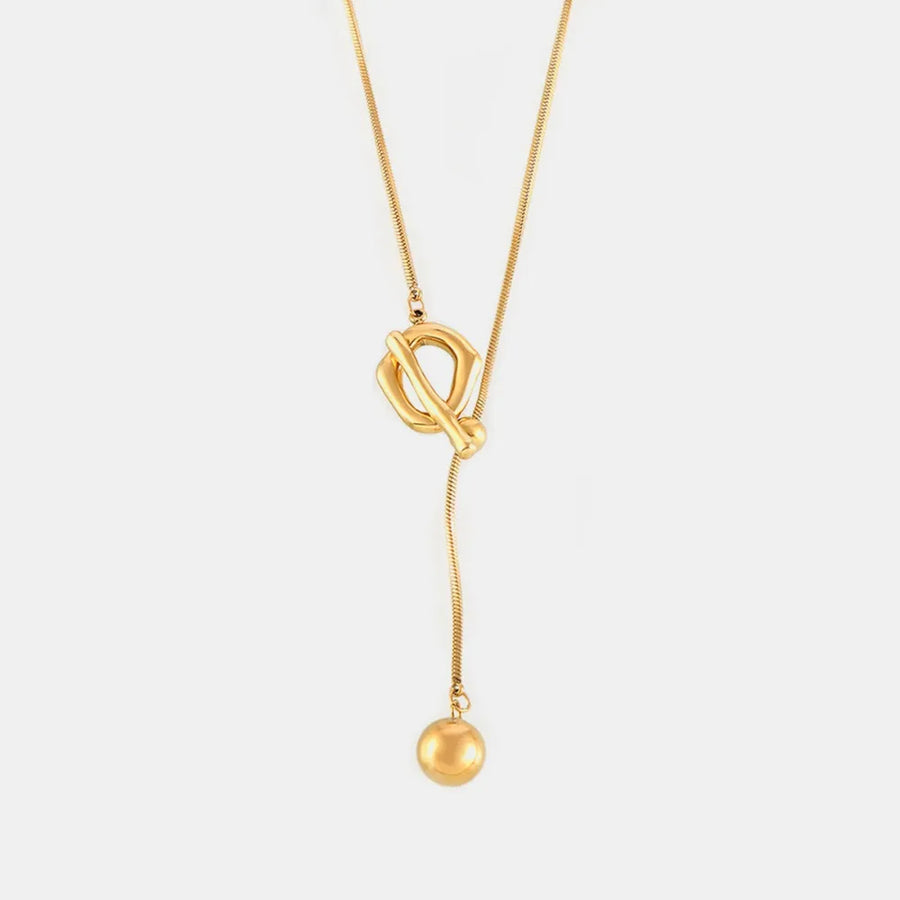 Gold lariat necklace with toggle closure and ball pendant