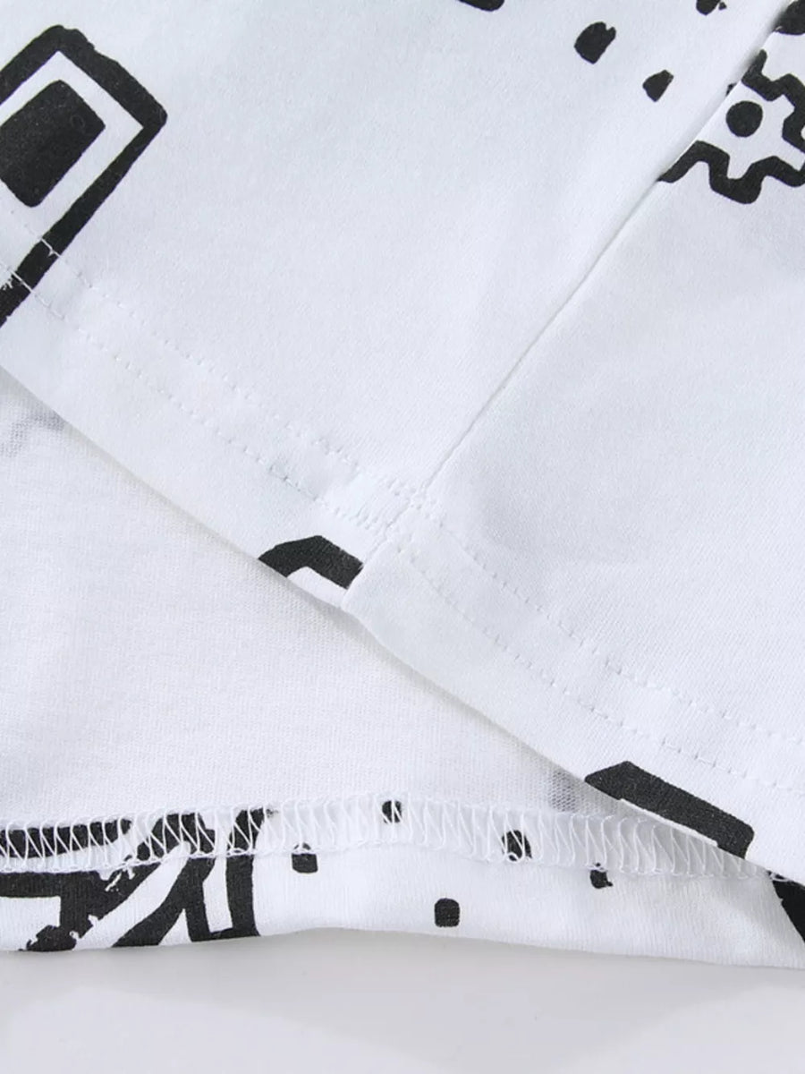 White cotton kids' t-shirt with black geometric construction vehicle print and stitched hem.