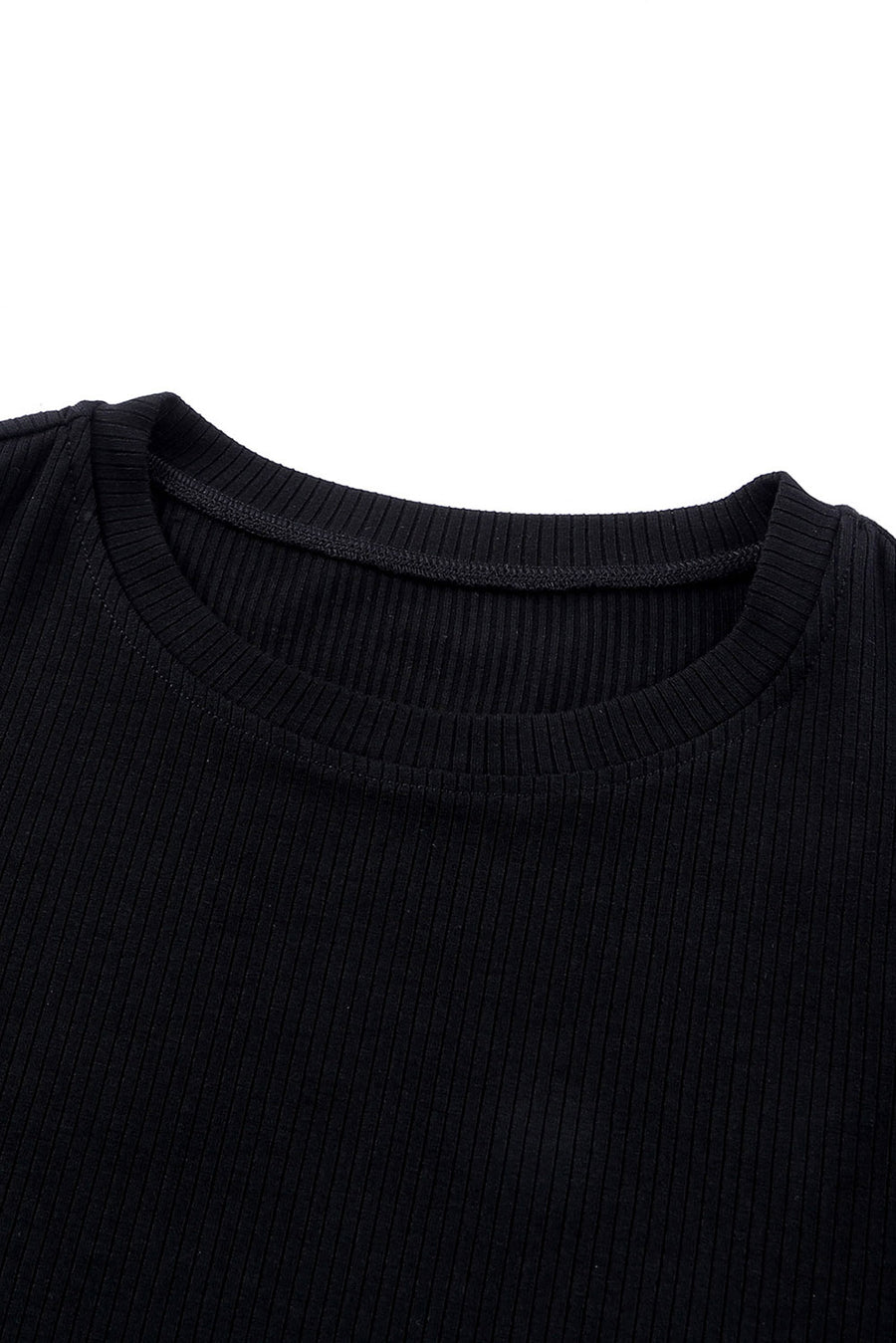 Black ribbed knit blouse with crew neck and dot mesh sleeves detail