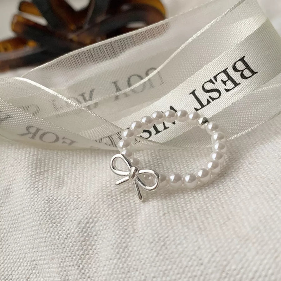 Synthetic Pearl, 925 sterling silver Care instructions: Avoid wearing during exe ring in silver with fitted silhouette