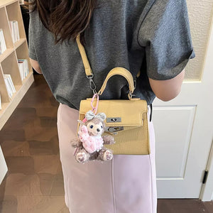 Yellow handbag with mini and turn-lock