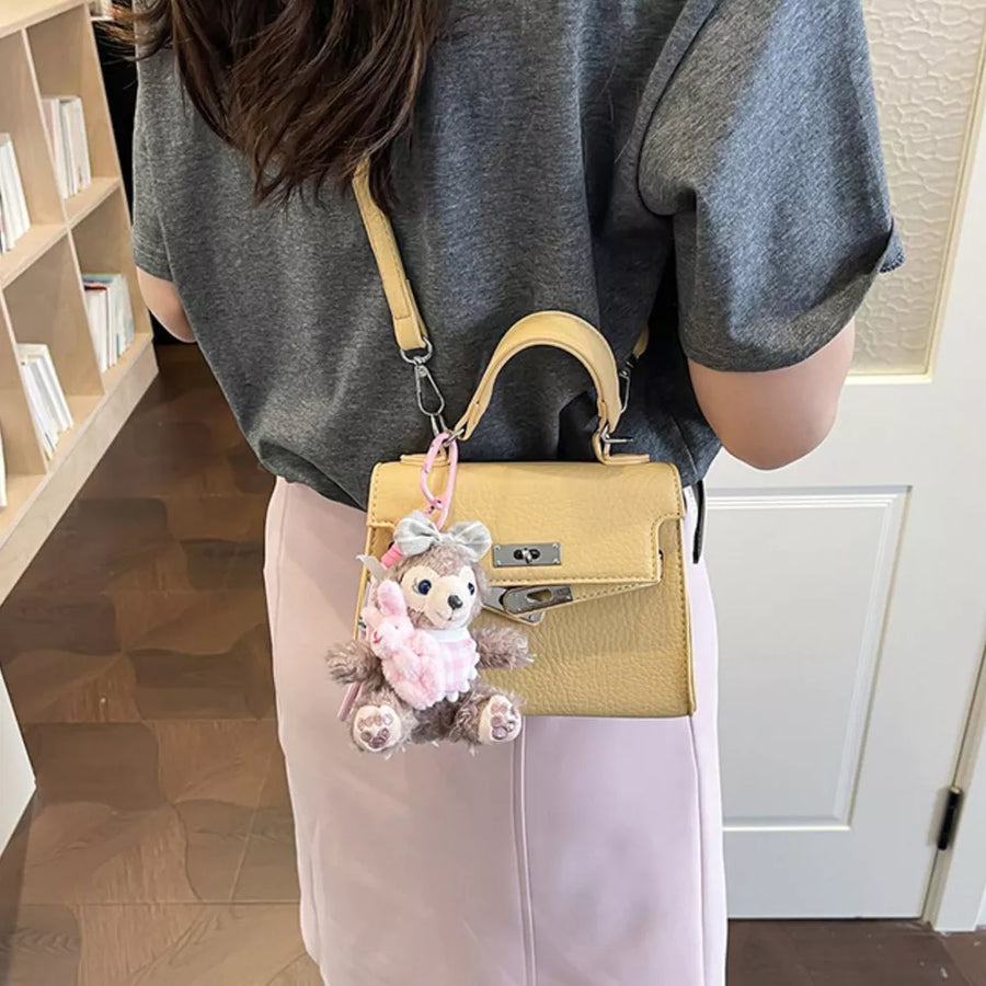 Yellow handbag with mini and turn-lock