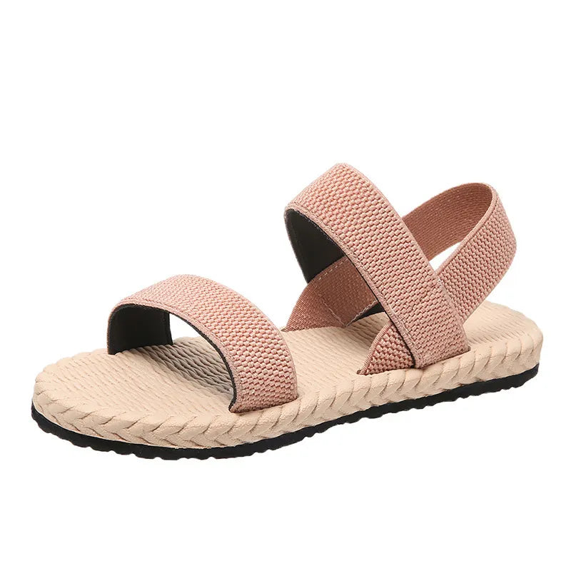 Dusty Pink rope-sole cross-strap sandals with adjustable straps.