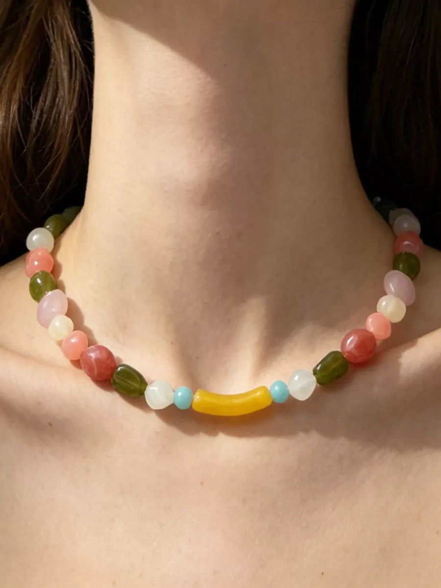 light pink choker featuring beaded and color-block