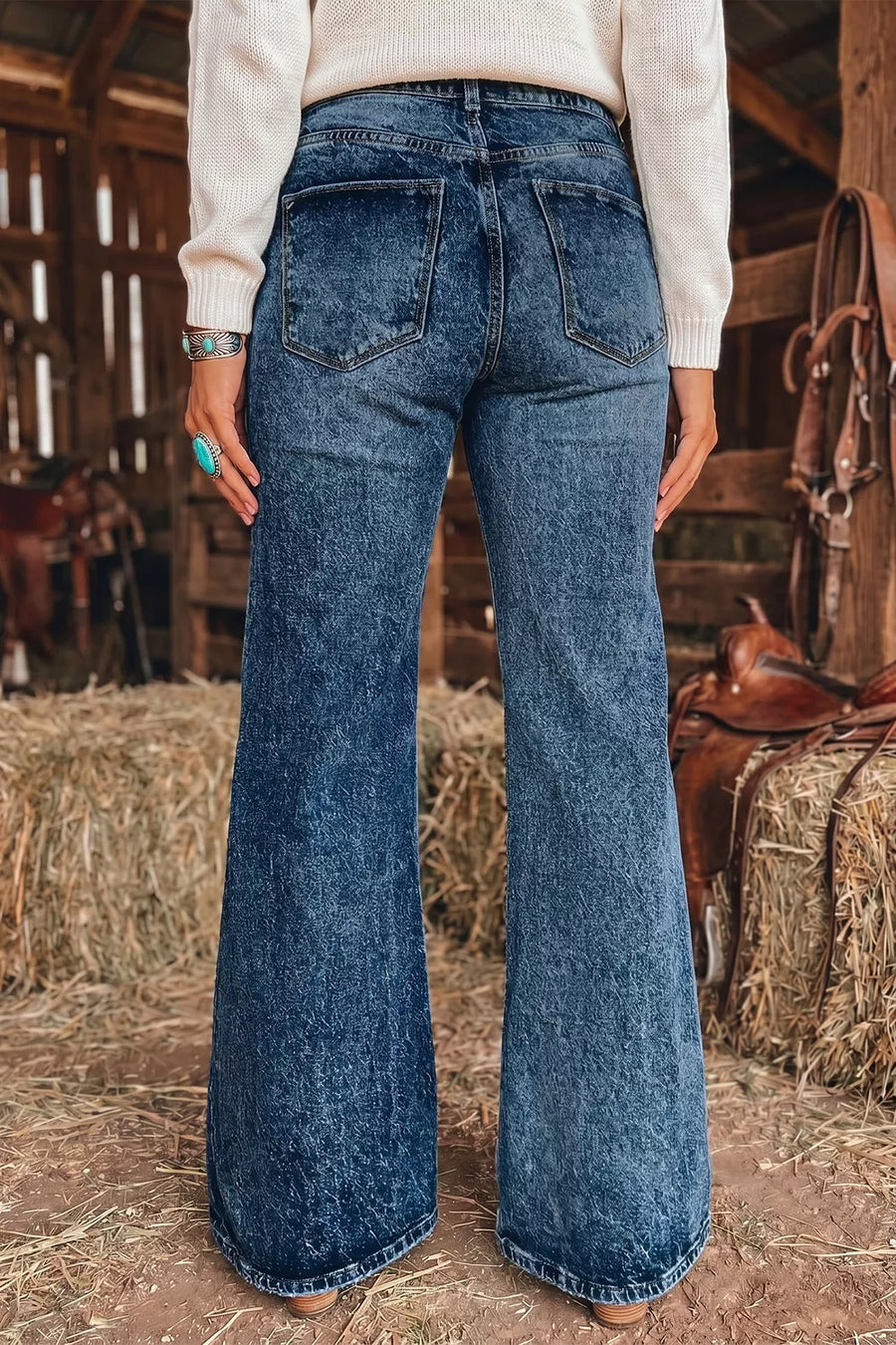 Navy flare jeans featuring buttoned and acid wash