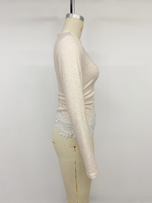 Light pink long sleeve top with white lace trim