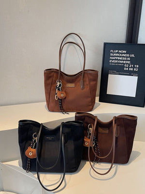 tote in camel featuring top handles and boxy fit
