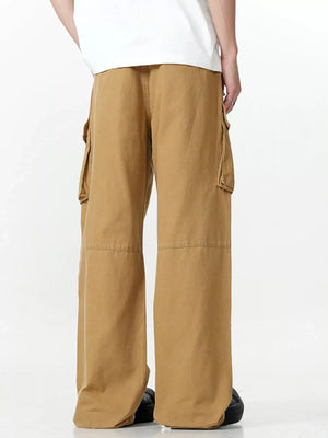 Men's khaki wide-leg cargo pants with multiple pockets and a relaxed fit.