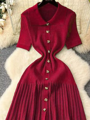 Red knit Peter Pan collar dress with button front and short sleeves.