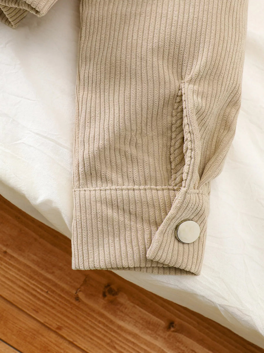 Casual tan corduroy jacket sleeve detail with button cuff and pocket