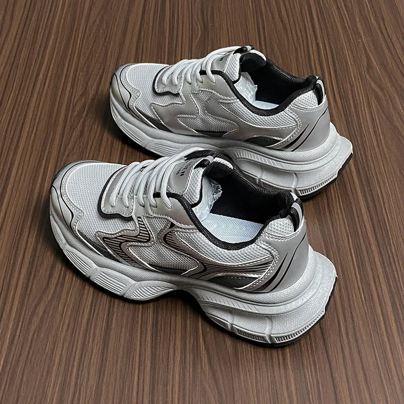 Silver metallic mesh chunky trainers with athletic design and breathable mesh.