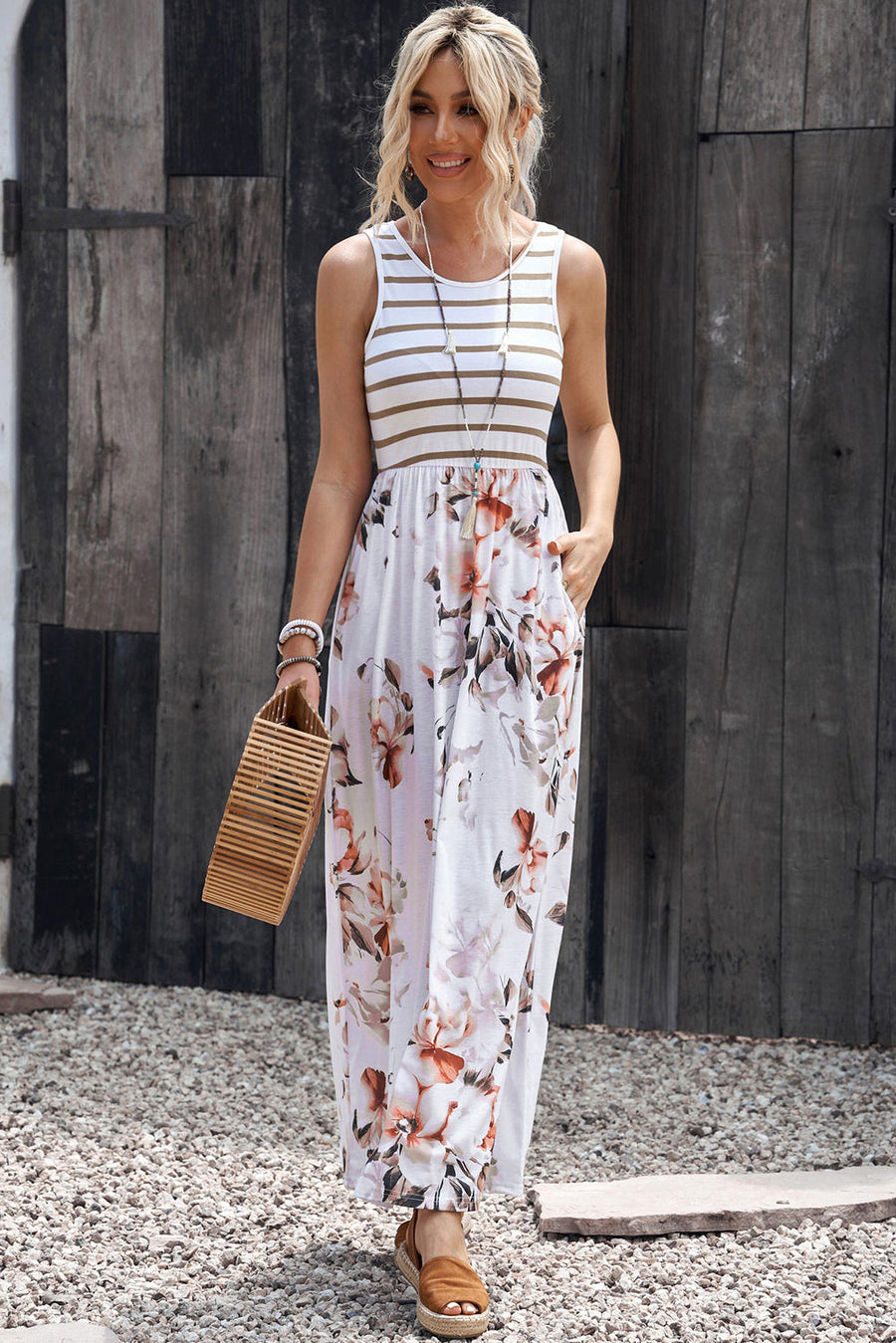 Striped bodice floral maxi dress with pockets, sleeveless, round neck, and A-line cut.