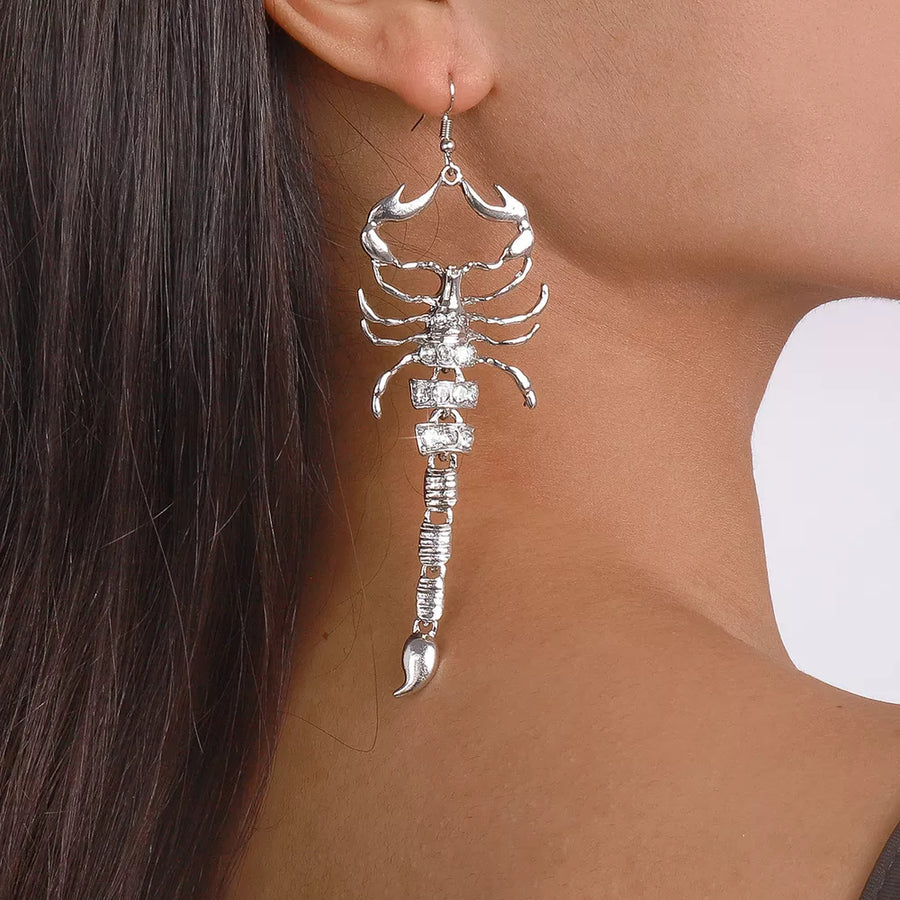 clear earrings featuring dangle and animal motif