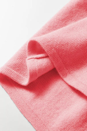 Pink acrylic knit cardigan with button front detail