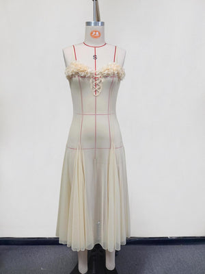 Cream floral corset dress with lace-up front and pleated sheer skirt