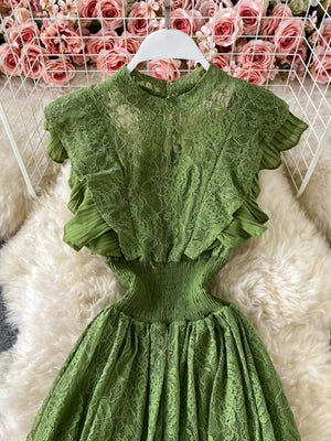 Green lace maxi dress with ruffled sleeves and smocked waist detail