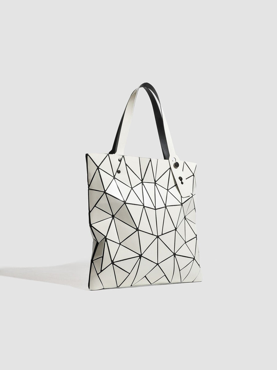 black handbag with snap and geometric