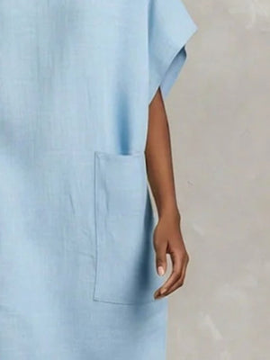 100% polyester Care instructions: Machine wash cold shift dress in Navy Blue with relaxed silhouette