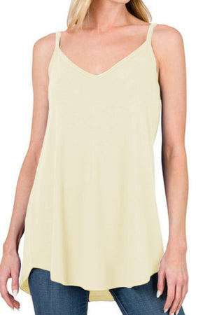 Ivory cami with spaghetti straps and curved hemline