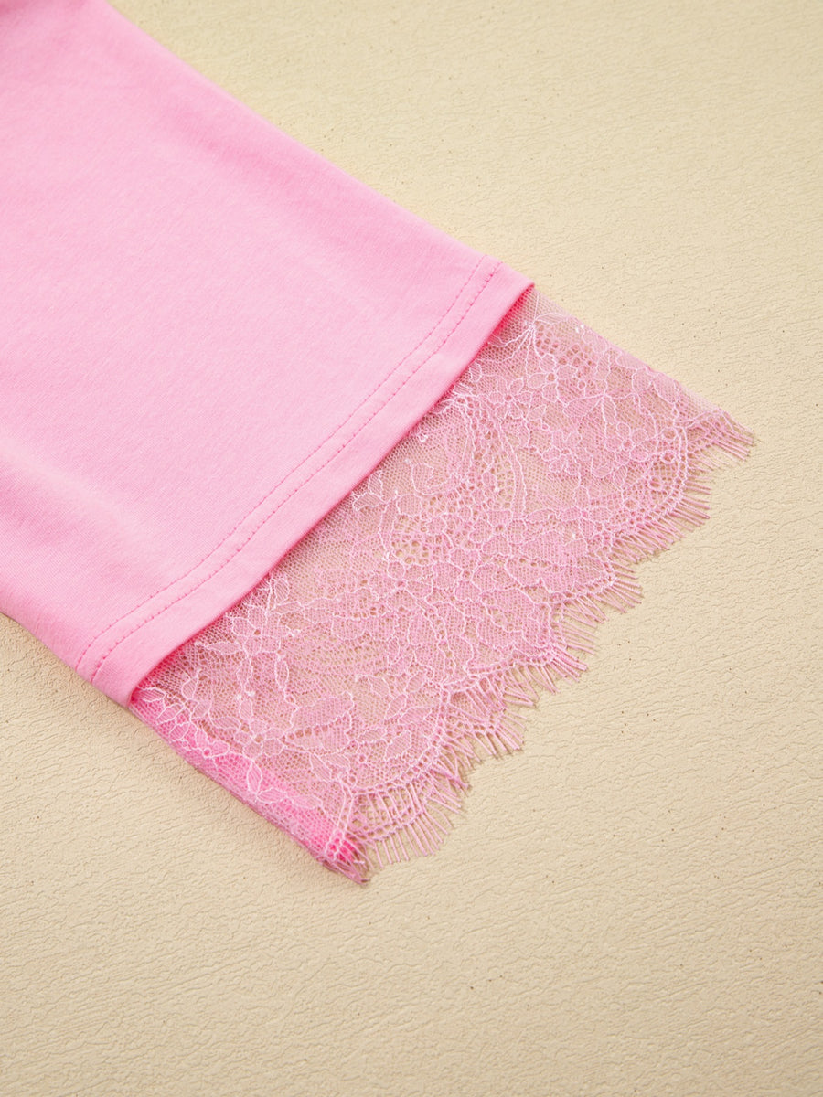 Pink cotton blend oversized tee with floral lace trim detail on the sleeve.