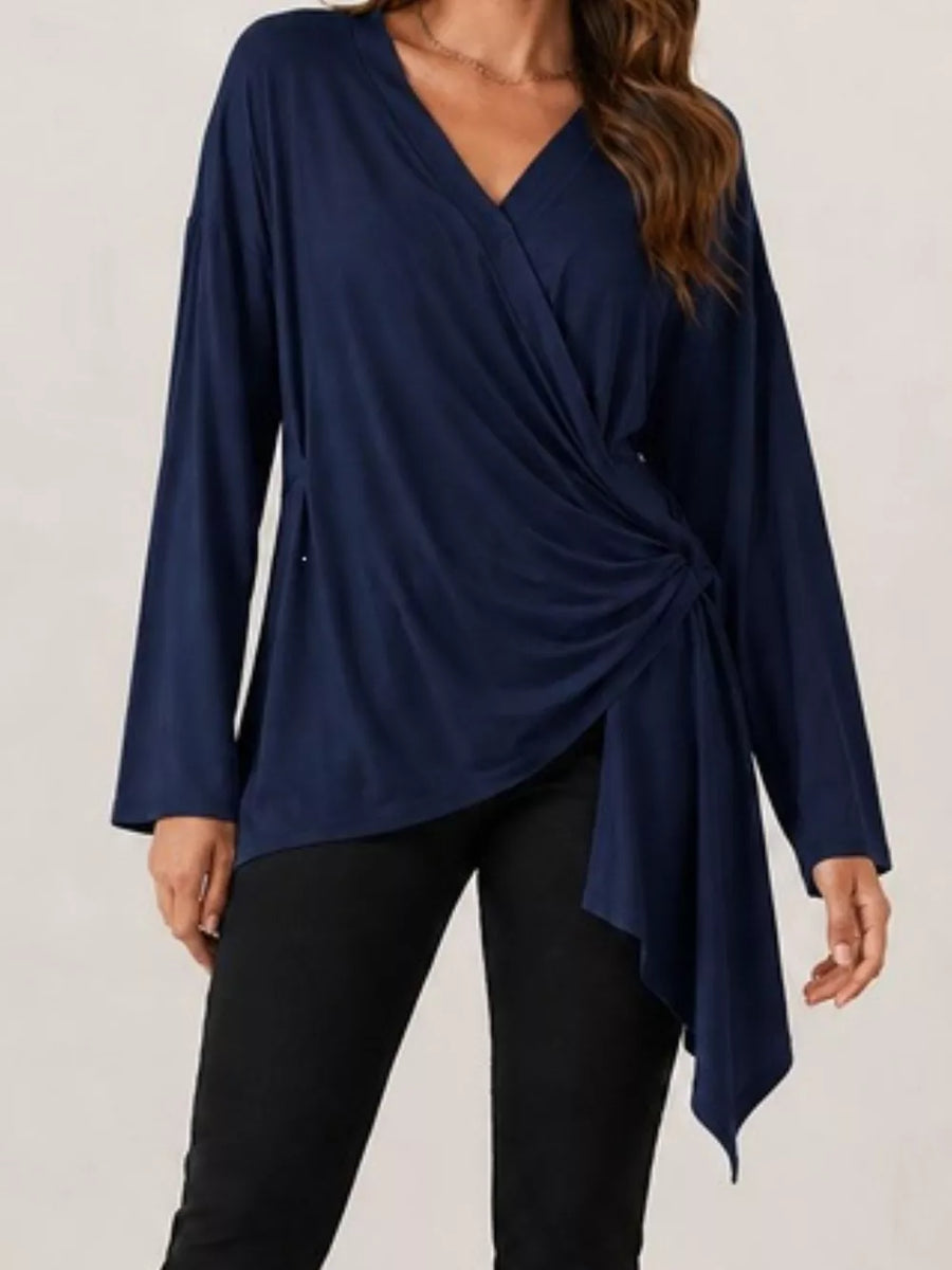 wrap top in Black with asymmetrical and hip-length