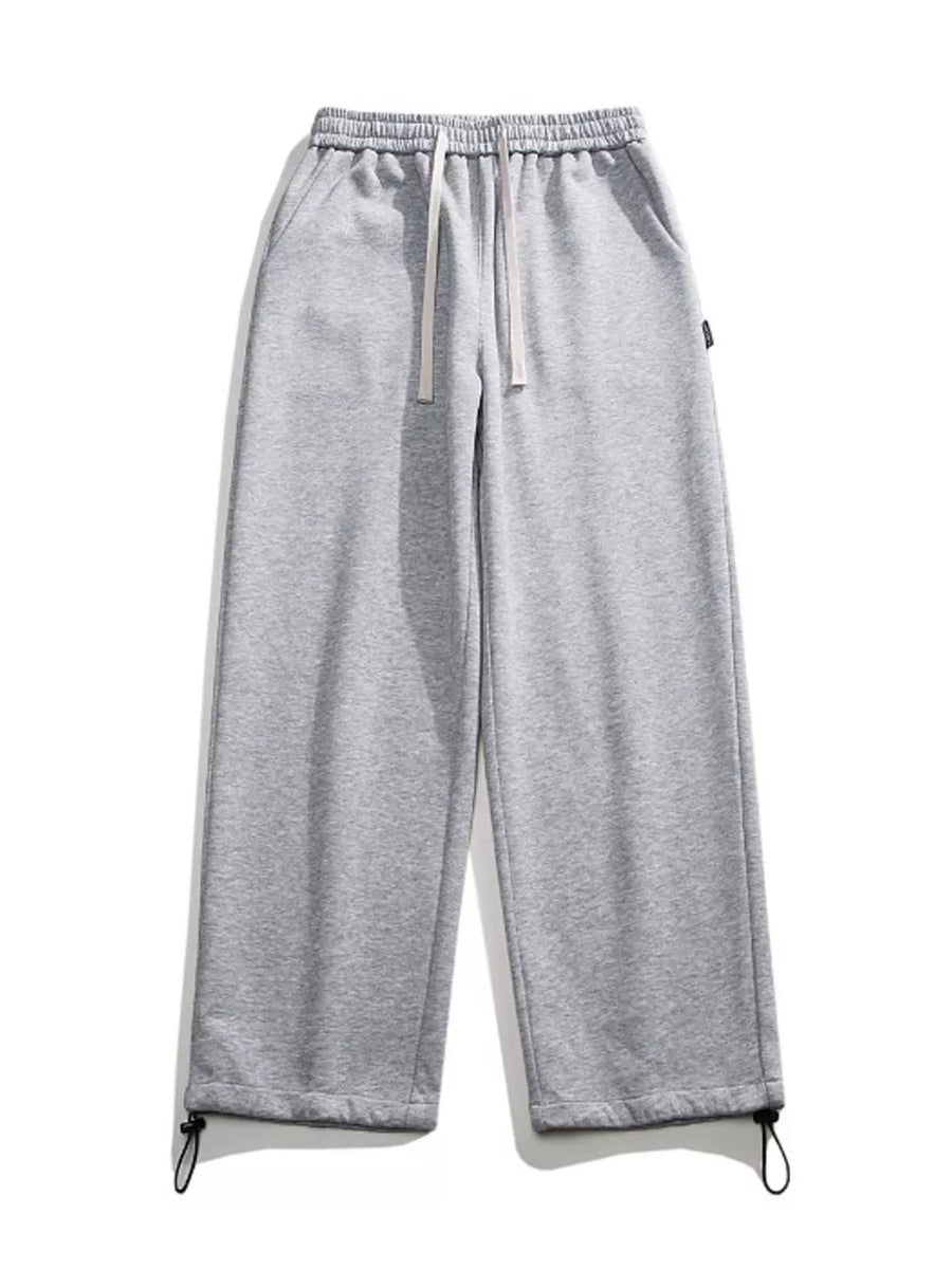 Light gray cotton sweatpants with drawstring waist and adjustable ankle cuffs.