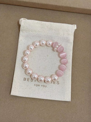 bracelet in light pink featuring beaded and fitted fit