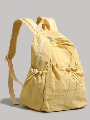 Yellow lightweight nylon backpack with adjustable straps and drawstring pockets.