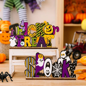 decorative ornament in green with striped and Halloween motifs