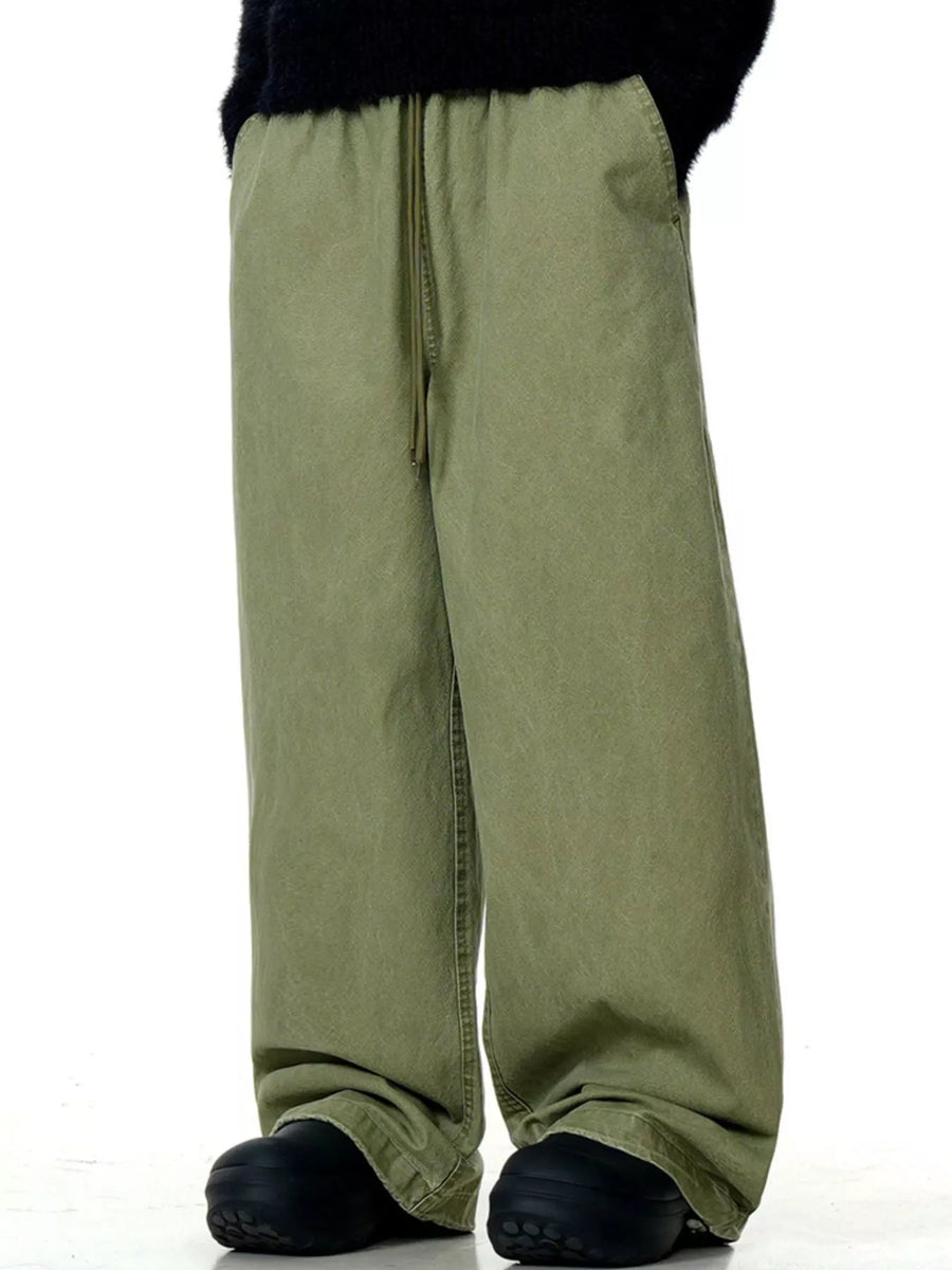 Relaxed wide-leg drawstring trousers in army green with a comfortable fit.