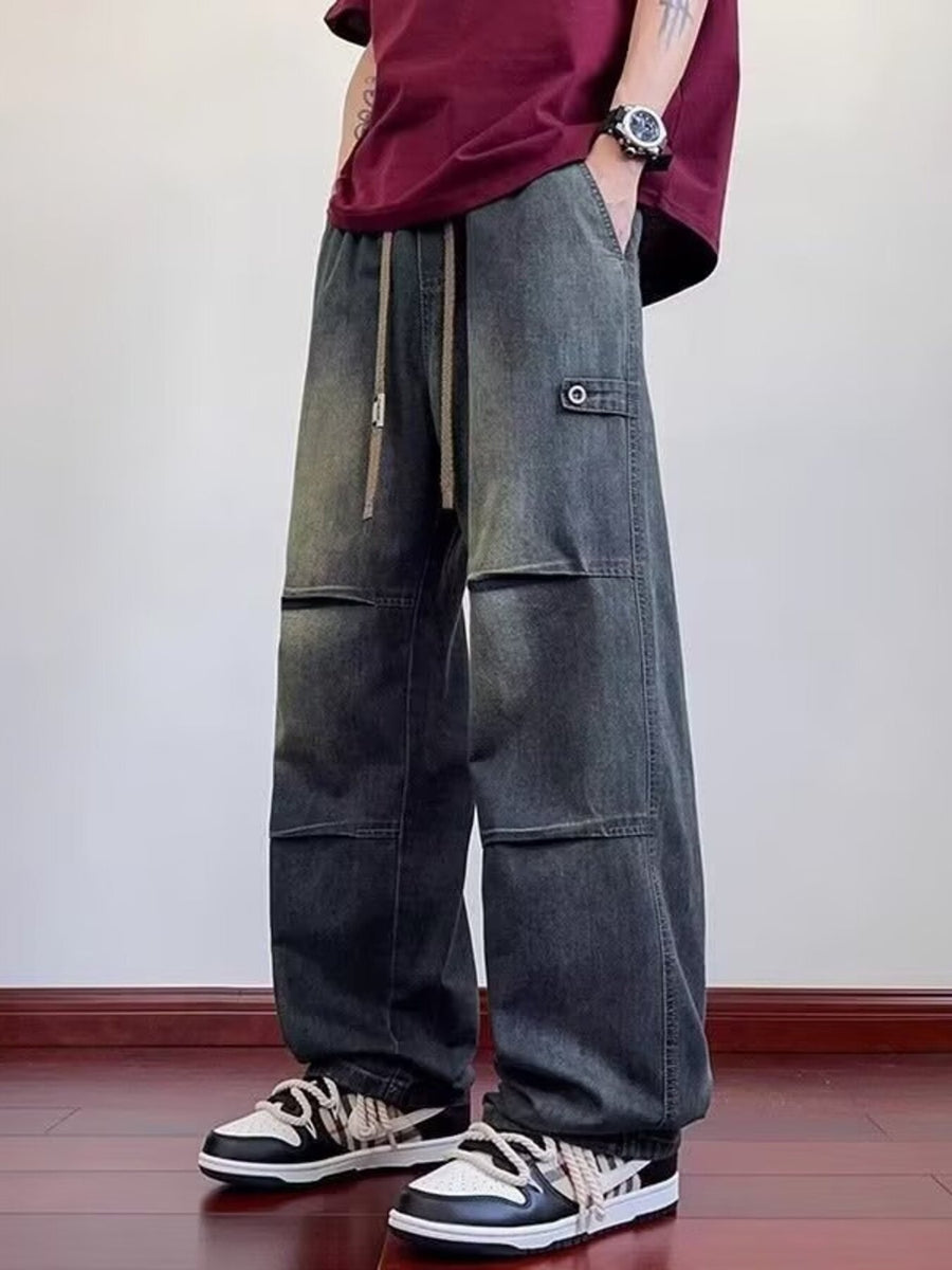 Dark wash denim cargo pants with drawstring waist and patch pocket