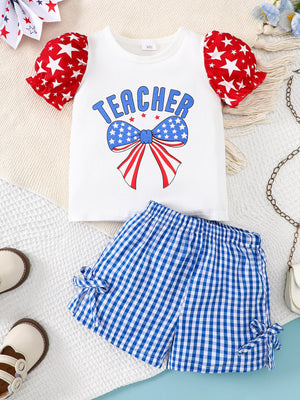 Baby girl teacher graphic tee with star print puff sleeves and blue gingham bow shorts.
