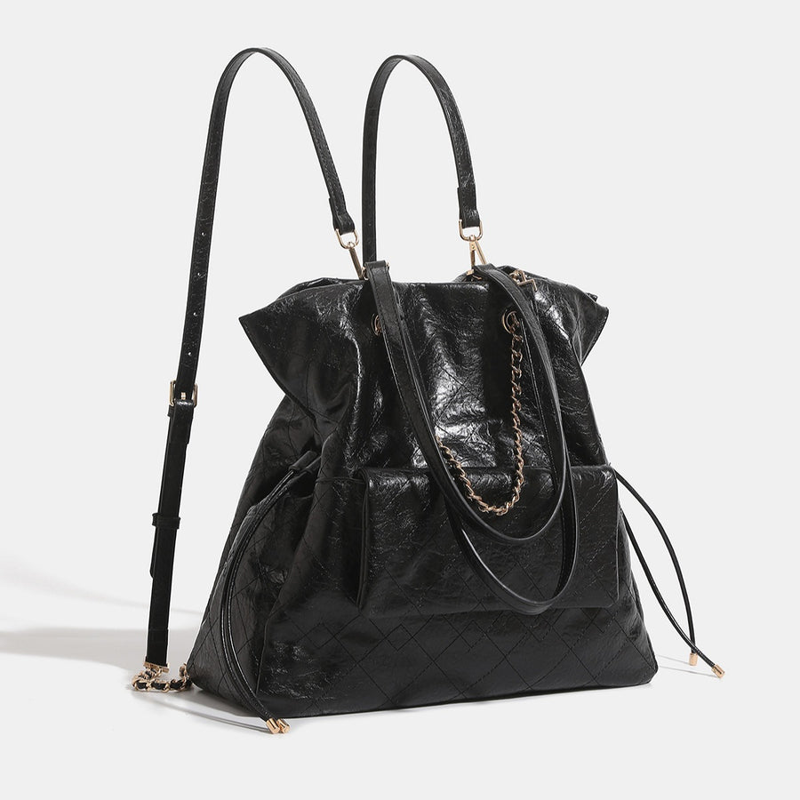 White backpack featuring quilted and geometric