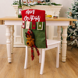 Festive chair cover in red and green with Merry Christmas text and reindeer applique.