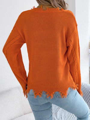 Orange v-neck sweater featuring distressed and cable knit