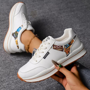 sneakers in black with graphic-print and round toe