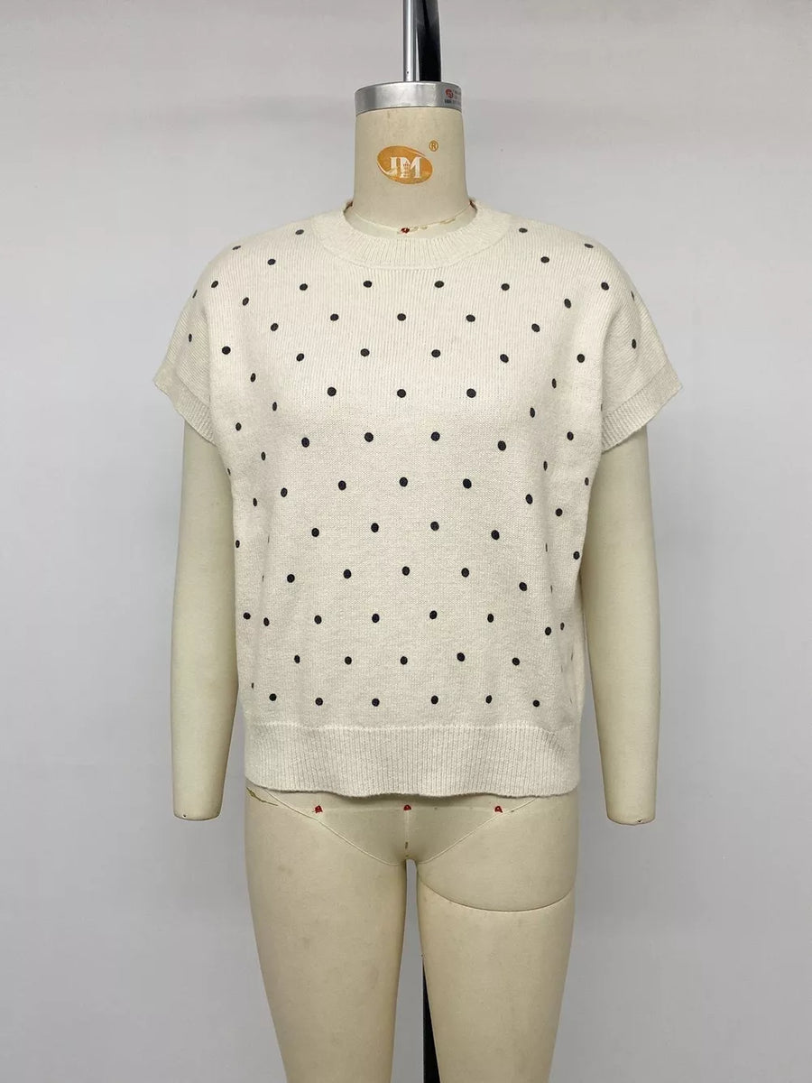 cream pullover sweater with ribbed cuffs and short sleeve