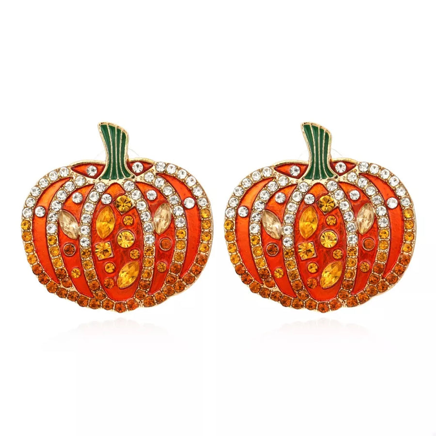 earrings in gold with motif and rhinestone embellishment