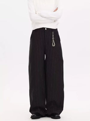 Black pinstripe wide-leg sweatpants with a pearl charm detail on the hip.