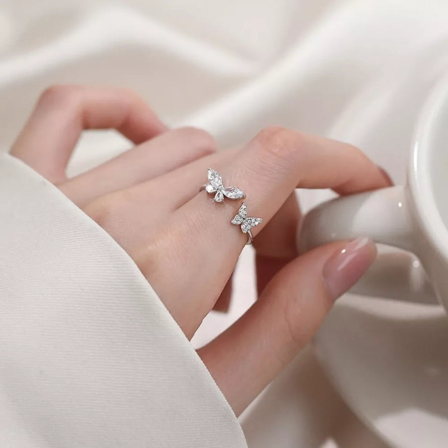 ring featuring butterfly in clear with 925 sterling silver,Zircon Care instructions: Avoid wearing during exercise, as